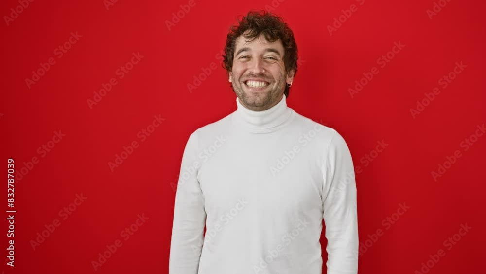 Cheeky young hispanic man wearing a sweater, making a hilarious fish face. his eyes squint in comedy over an isolated bright red backdrop Cheeky young hispanic man wearing a sweater, making a hilarious fish face. his eyes squint in comedy over an isolated bright red backdrop