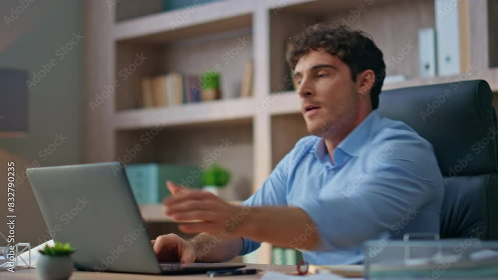 Angry executive video call remotely closeup. Emotional mad manager close laptop Angry executive video call remotely closeup. Emotional mad manager close laptop