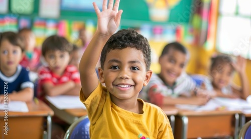 Children raise their hands to answer in the classroom. Back To School concept. Backdrop with selective focus