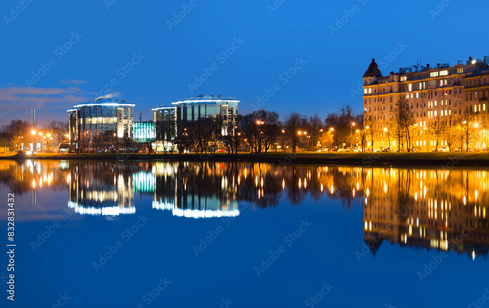 Twilight cityscape with reflective waterfront