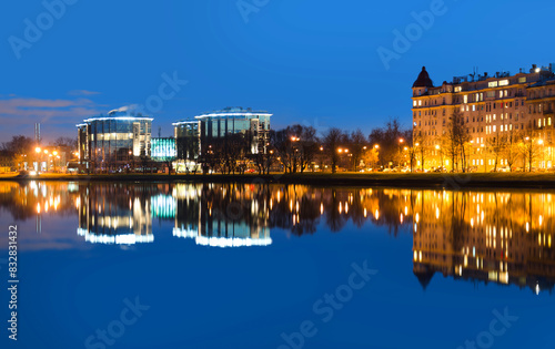 Twilight cityscape with reflective waterfront © Bryan