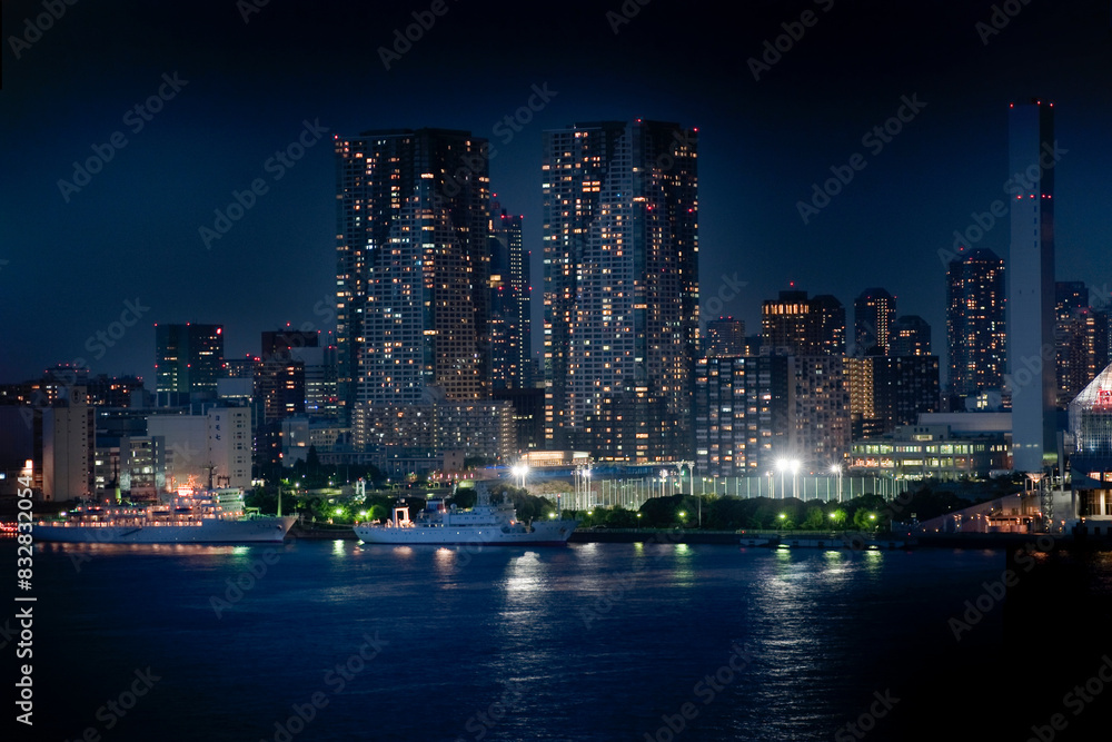 Urban nightscape: city skyline and waterfront illumination