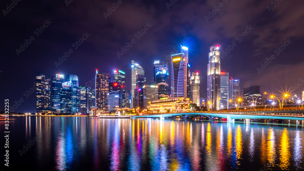 Dazzling city skyline at night with reflective waterfront