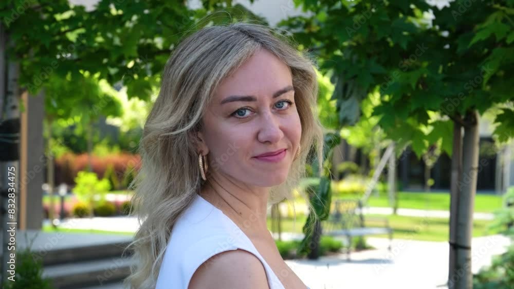 face of beautiful blond sexy smiling woman with long hair. Portrait of gorgeous girl looking to camera face of beautiful blond sexy smiling woman with long hair. Portrait of gorgeous girl looking to camera