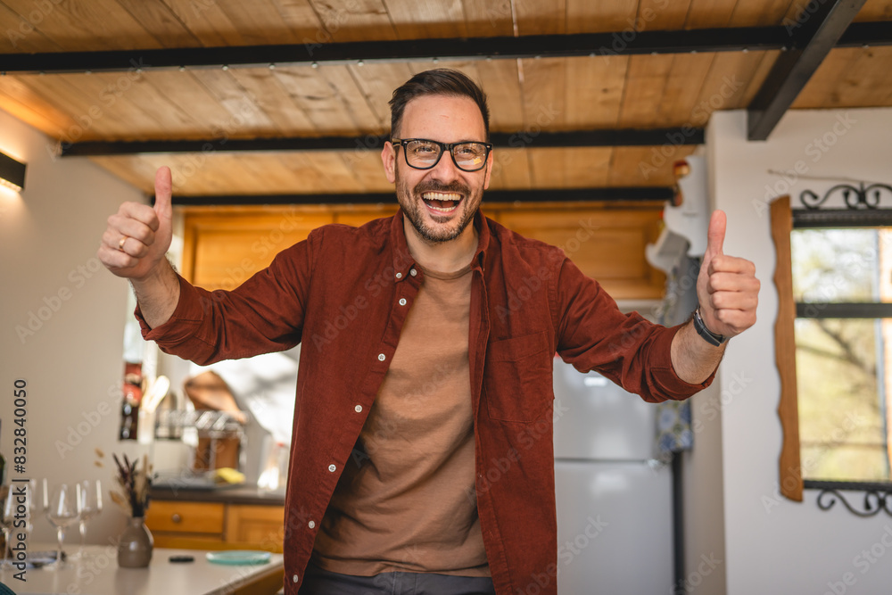 Portrait of one adult caucasian man stand at home and smile positive Portrait of one adult caucasian man stand at home and smile positive