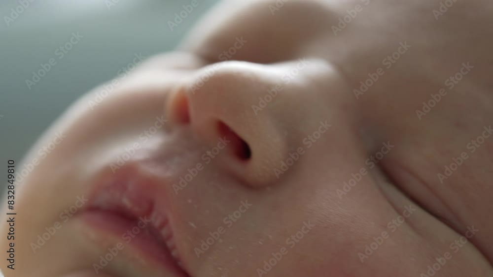Macro shot of a newborn's face, focusing on the delicate skin, closed eyes, and peaceful expression.  pure innocence and tranquility of a newborn's peaceful sleep