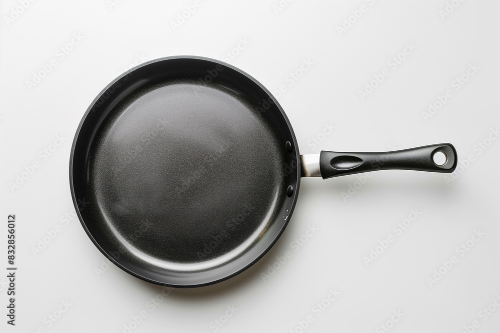 Frying Pan With Black Handle on White Wall Frying Pan With Black Handle on White Wall