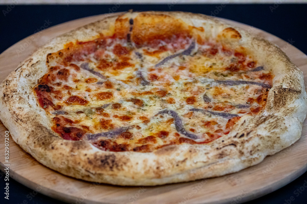 Traditional alicci or anchovy pizza, isolated in selective focus Traditional alicci or anchovy pizza, isolated in selective focus