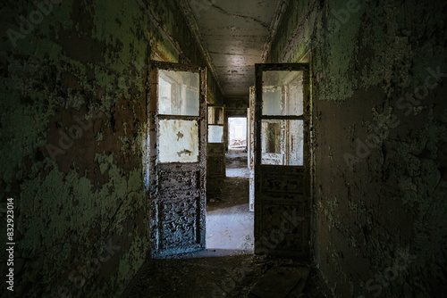 Corridor with peeled paint in old abandoned building