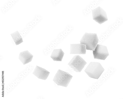 Fotografi Refined sugar cubes in air on white background