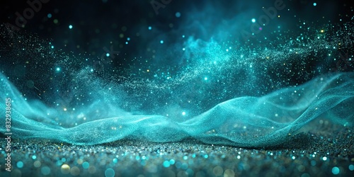 Enchanting teal blue glitter particles creating a misty veil over a deep black abstract background photo