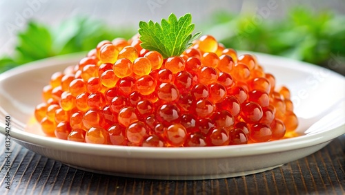 Close-up shot of red salmon caviar on a white plate photo