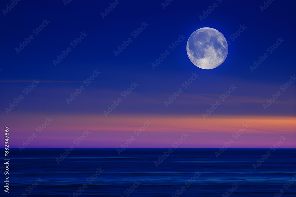 Admire the full moon over the ocean at night with a colorful blue sky and peaceful coastline. Perfect for nature and astronomy enthusiasts. Admire the full moon over the ocean at night with a colorful blue sky and peaceful coastline. Perfect for nature and astronomy enthusiasts.