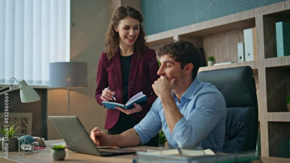 Smiling employees talking workplace. Happy businessman discussing work ideas Smiling employees talking workplace. Happy businessman discussing work ideas