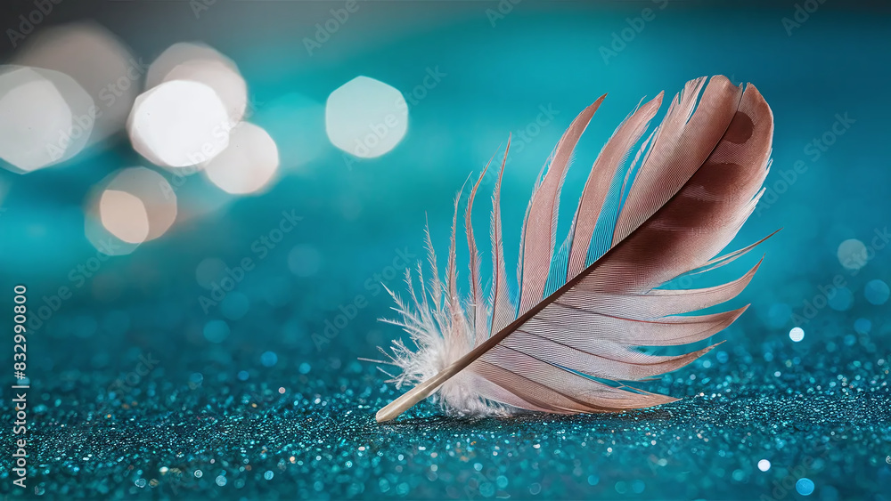 Naklejka premium beautiful white feather on turquoise bokeh background, space for copy text