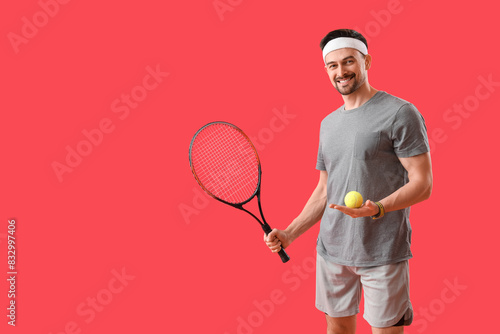 Sporty young man with tenni...