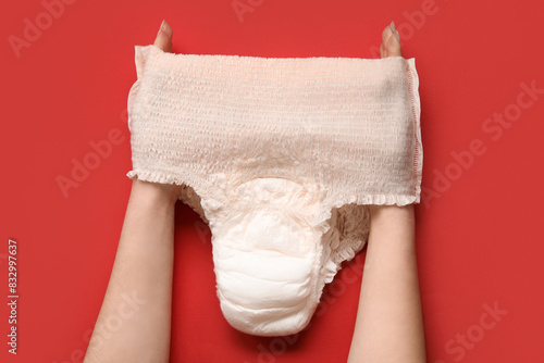 Woman with period panties on red background