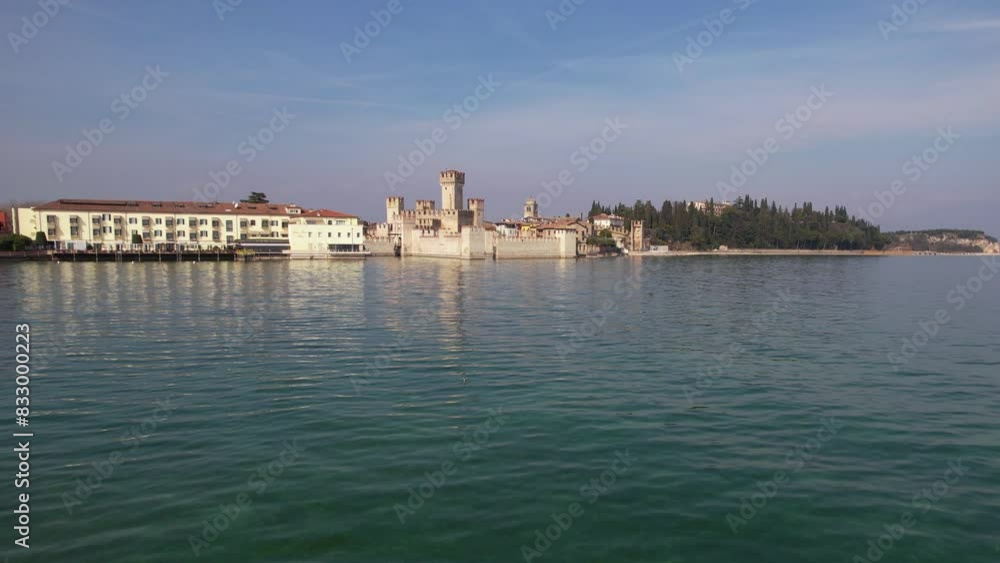 Revealing Drone Shot of Scaligero Castle From Lake Garda, Sirmione, Lombardy, Italy Revealing Drone Shot of Scaligero Castle From Lake Garda, Sirmione, Lombardy, Italy