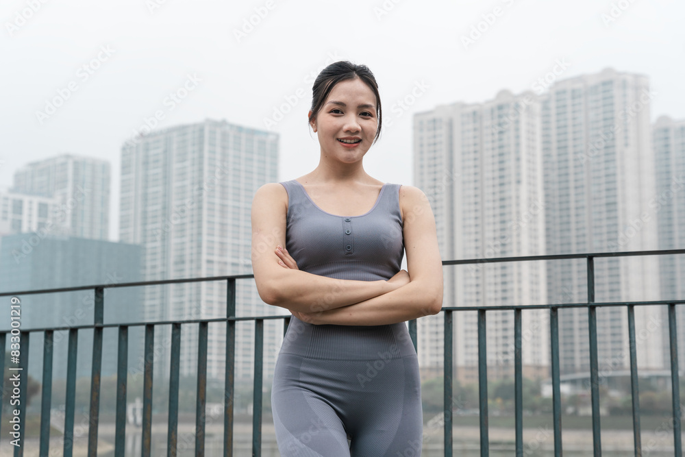 Fototapeta premium Portrait of Asian girl exercising at the park
