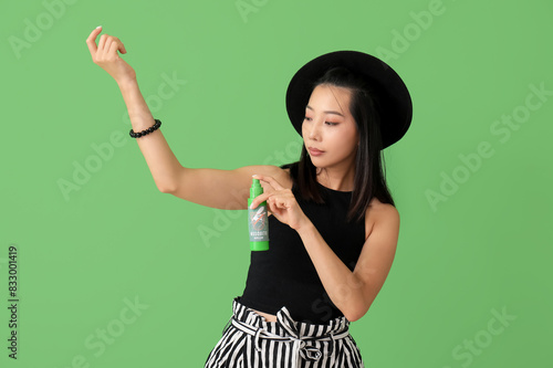 Young Asian woman with mosq...