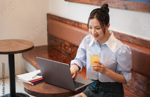 Portrait of Asian woman working at a coffee shop