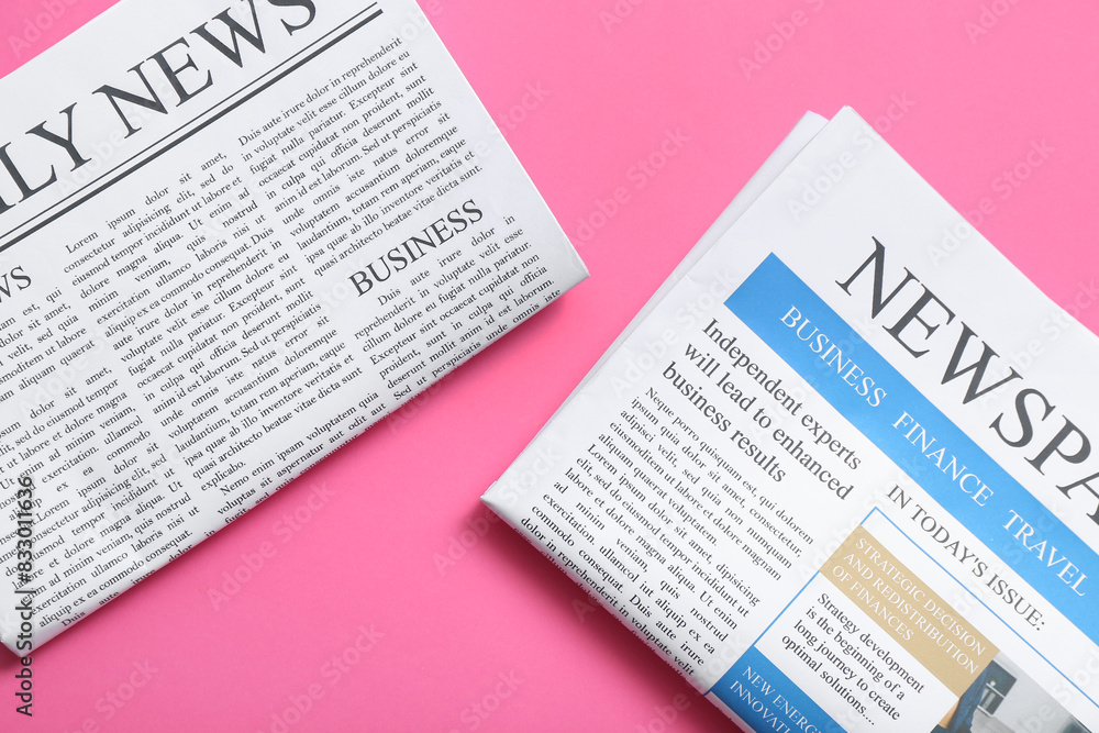 Different newspapers on pink background Different newspapers on pink background