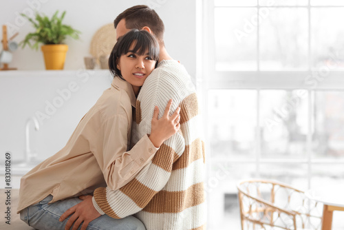 Young loving couple hugging...