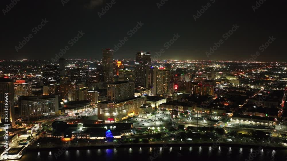 Vibrant night skyline of New Orleans with this stunning aerial footage. City's illuminated buildings and landmarks in all their glory