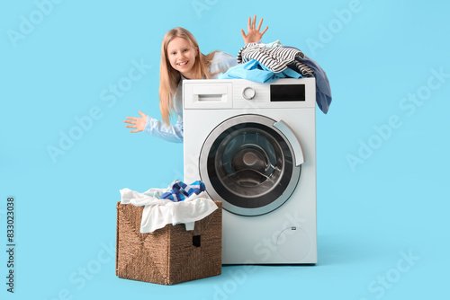 Happy little girl near wash...