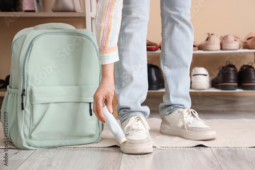 Woman in stylish sneakers w...