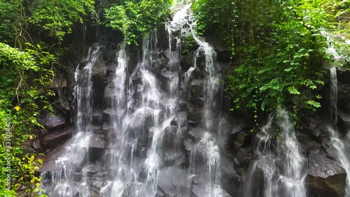 Kanto Lampo, a big cascade waterfall with a shallow pool and a bat cave nearby, Bali, Indonesia