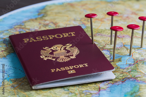 Pins Marking Travel Itinerary Points on Map with Two Passport