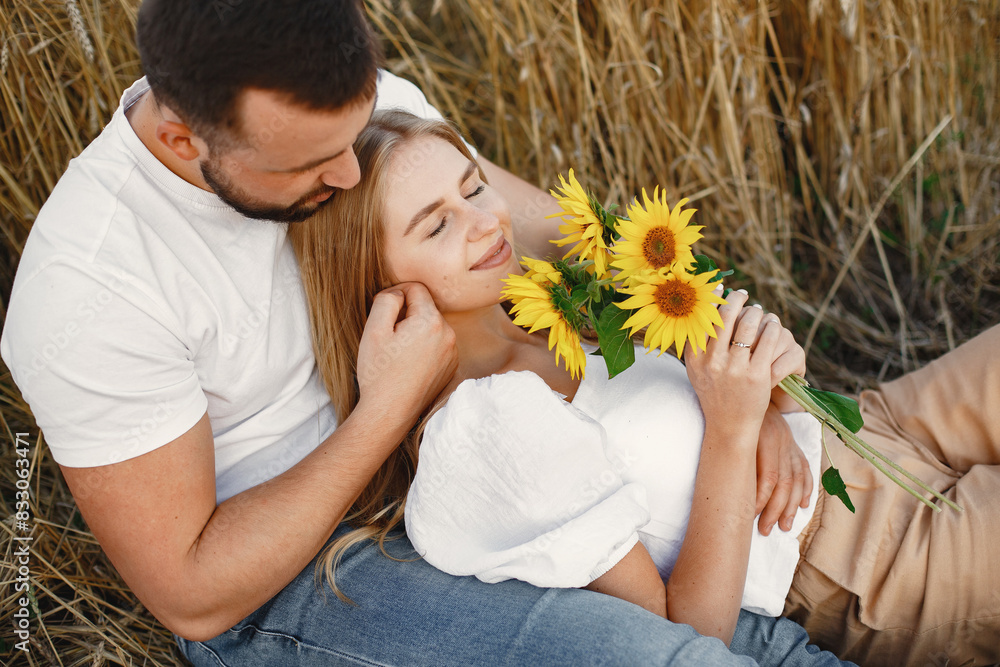 Beautiful couple spend time in a autumn field Beautiful couple spend time in a autumn field