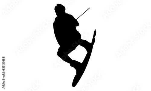 silhouette of man wakeboarding in the sea beach