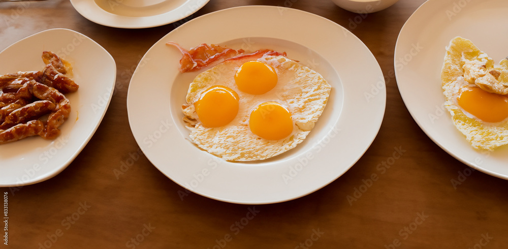 Morning breakfast, ham and eggs arranged on the table from top view Morning breakfast, ham and eggs arranged on the table from top view
