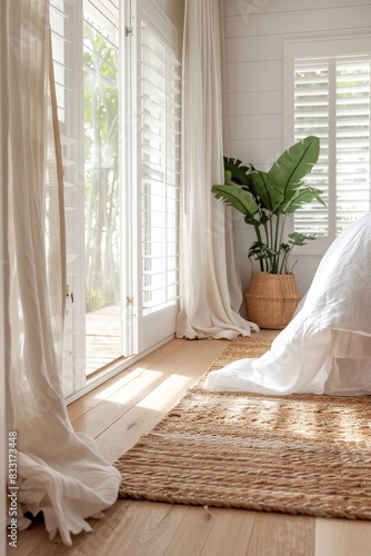  A Coastal Style Home features white plantation shutter windows