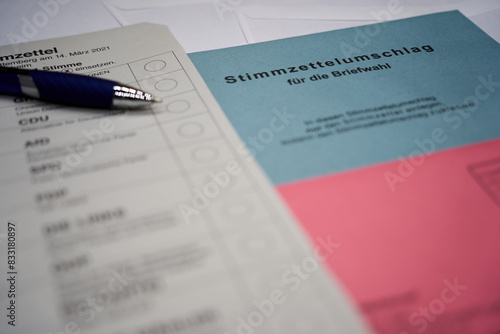 German voting ballot with a blue pen. ( translation of german word Briefwahl: Postal vote ). Envelope, symbolizing postal voting in democracies. photo