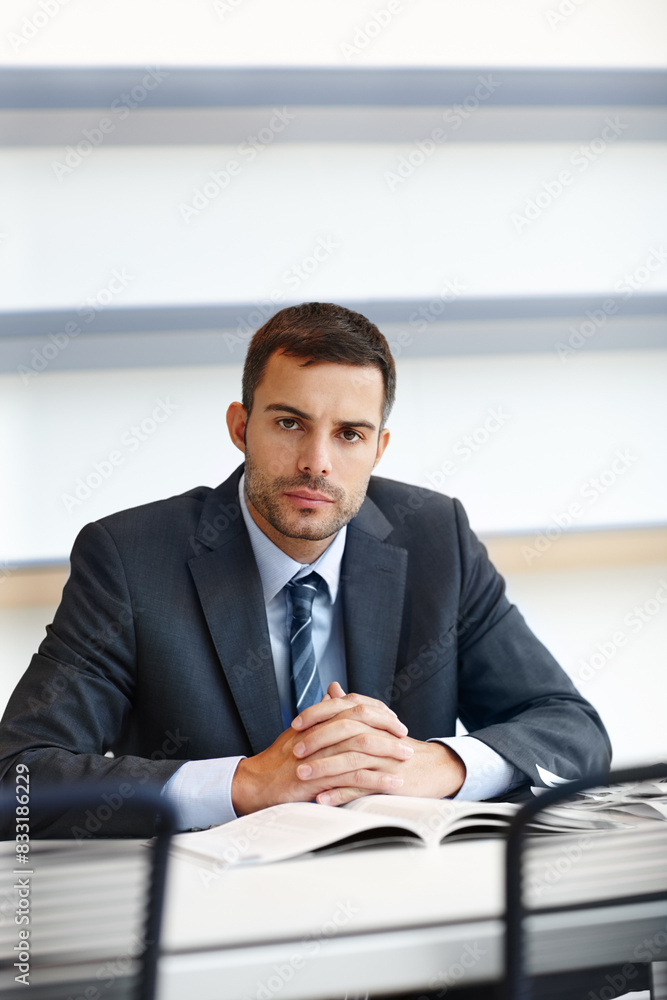 Portrait, serious and male lawyer at desk with documents, evidence and research in office. Businessman, consultant and critical thinking at table for career, expertise and records in corporate firm Portrait, serious and male lawyer at desk with documents, evidence and research in office. Businessman, consultant and critical thinking at table for career, expertise and records in corporate firm