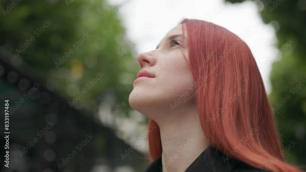 Adolescent Girl with Red Hair Enjoying a Tranquil Moment Outside Adolescent Girl with Red Hair Enjoying a Tranquil Moment Outside