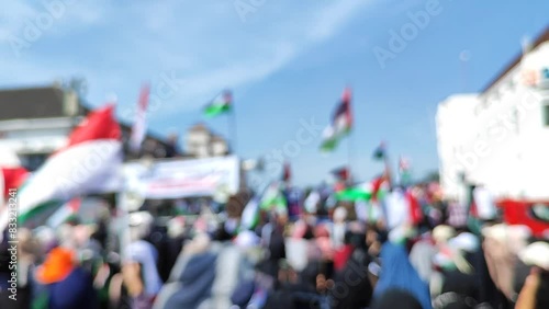 Blurry video of demonstrations supporting Palestinian independence and denouncing Israeli genocide photo