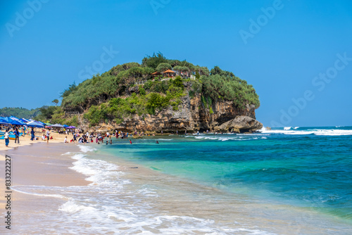 Yogyakarta, 11 May 2024: Drini Beach is one of the tourist attractions visited by many tourists, located in Banjarejo Village, Tanjungsari District, Gunungkidul. photo