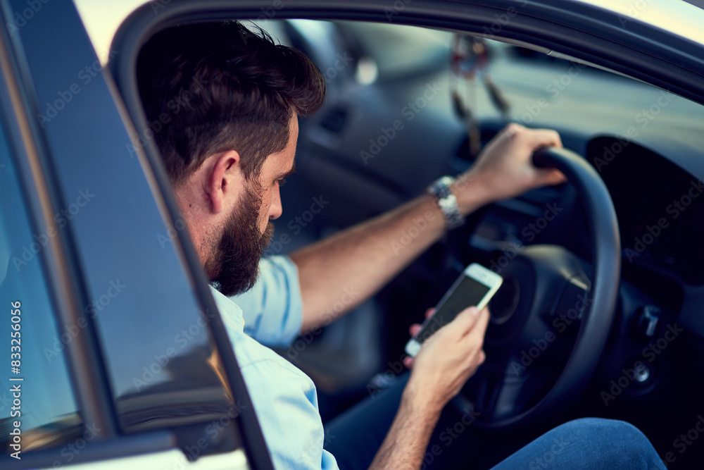 Car, phone and travel with driver man reading app for directions, map or navigation to destination. Driving, location and transport with person in vehicle to search route on mobile for journey Car, phone and travel with driver man reading app for directions, map or navigation to destination. Driving, location and transport with person in vehicle to search route on mobile for journey