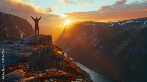 Triumphant Silhouette at Sunset on Mountainous Cliff Edge