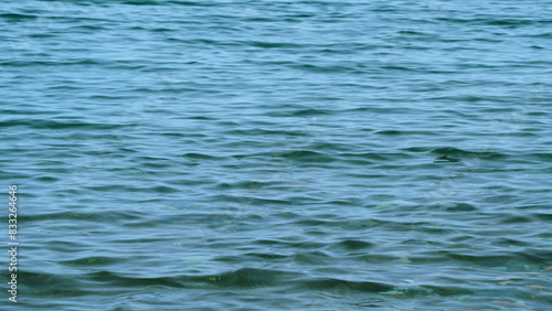 Blue Sea Waves. Sea Calm Background. Gentle Waves On Dark Blue Water. Sea Water Surface. Close up.