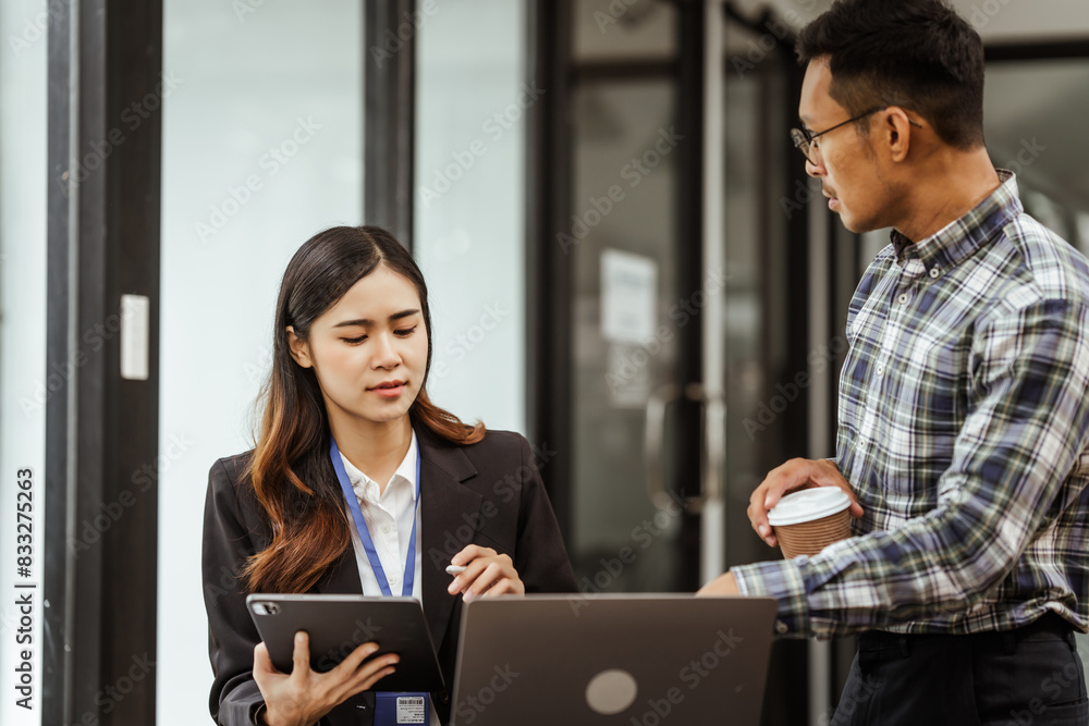 Young businesswoman and other Asian individuals are seen working at desks. Accountability, faultfinding, negligence, and other aspects of recruitment, staffing, and talent management being discussed. Young businesswoman and other Asian individuals are seen working at desks. Accountability, faultfinding, negligence, and other aspects of recruitment, staffing, and talent management being discussed.
