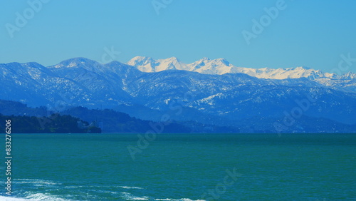 Nature Travel Background. Blue Sky And Snow-Capped Mountains. Still.