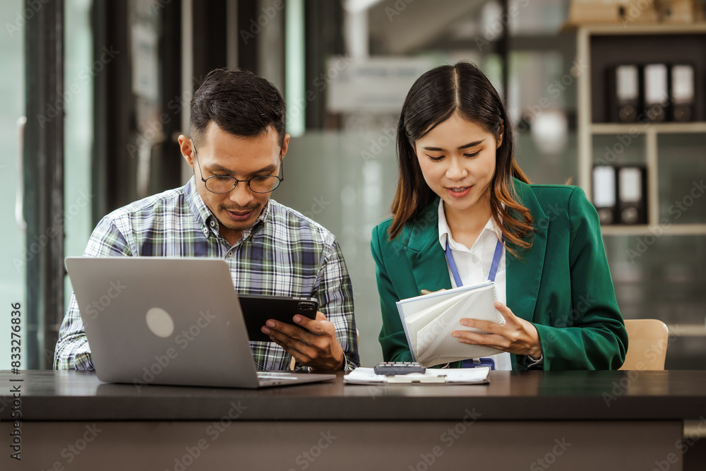 A middle-aged businessman, a young businesswoman, and Asian individuals are collaborating at desks. They engage in teamwork while managing commodities, trade, finance, and talent acquisition. A middle-aged businessman, a young businesswoman, and Asian individuals are collaborating at desks. They engage in teamwork while managing commodities, trade, finance, and talent acquisition.