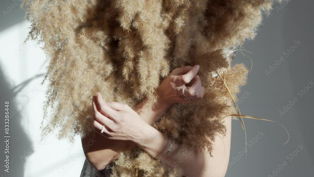 Beauty and tenderness in a rustic style. Women hands hug fluffy spikelets of cattail. Autumn idea concept for beauty footage. Promotional video Beauty and tenderness in a rustic style. Women hands hug fluffy spikelets of cattail. Autumn idea concept for beauty footage. Promotional video