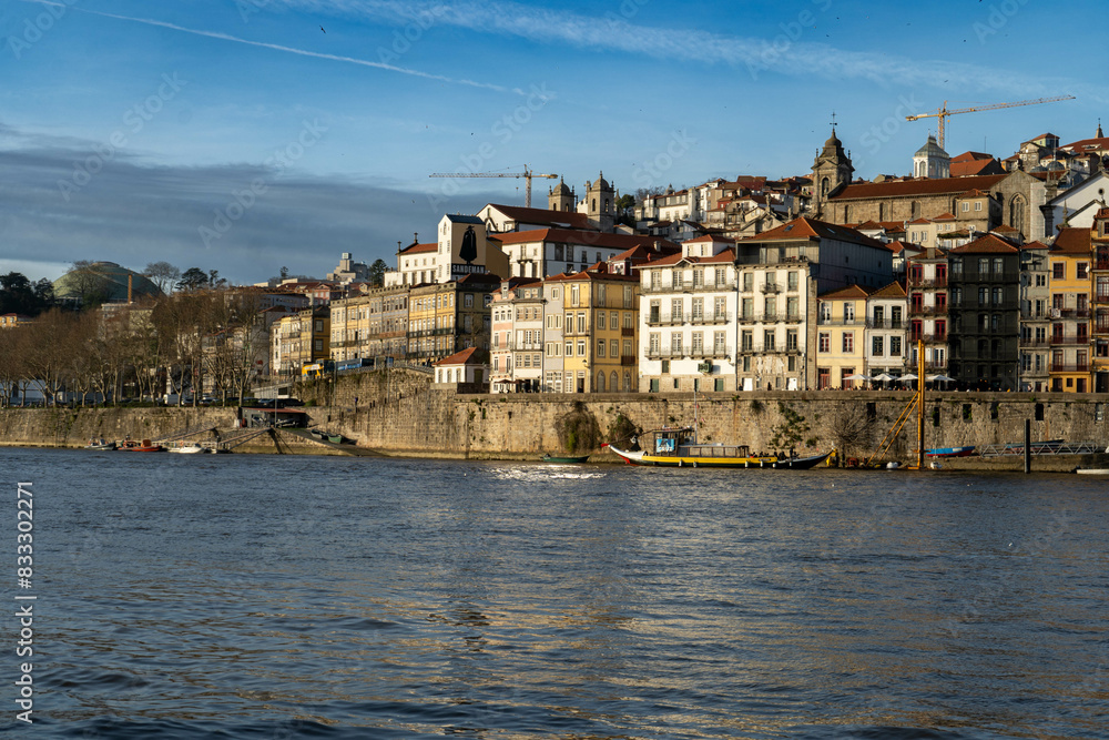 Fototapeta premium View of the Douro River, boats and the city of Porto.