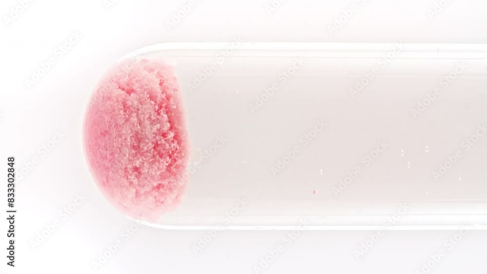 Close up tablet of aspirin, vitamin falls into of water in glass test tube in slow motion on white background. Macro shot of bubbles effervescent. The medicine concept, health care, treatment. 4k Close up tablet of aspirin, vitamin falls into of water in glass test tube in slow motion on white background. Macro shot of bubbles effervescent. The medicine concept, health care, treatment. 4k